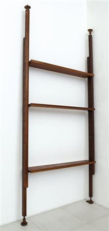 UNA LIBRERIA, anni "60. Ferro verniciato, legno di teak. Cm 300 (h) x 130 x 21.