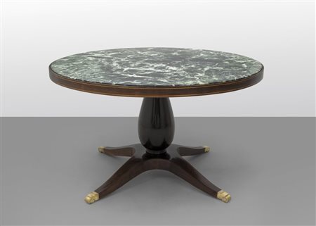 PAOLO BUFFA Un tavolo, anni '50. Legno impiallacciato in palissandro,...