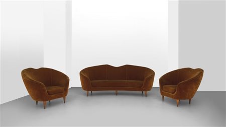 UN SOFA E DUE POLTRONE, anni '60. Strutture e gambe in legno, imbottiture...