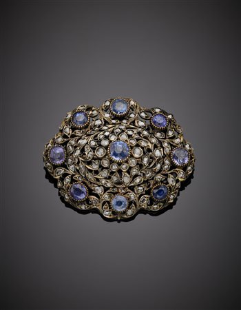 Spilla in oro giallo, argento, diamanti e dieci zaffiri rotondi g. 18,70,...