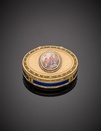 Tabacchiera ovale in oro giallo lucido e zigrinato, smalti guillochè blu e...