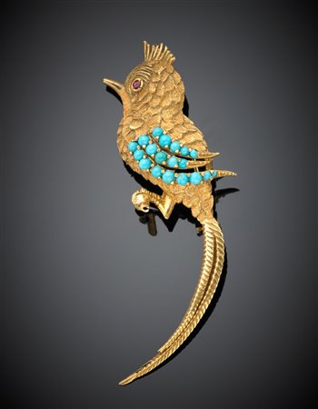 Spilla a guisa di uccello del paradiso in oro giallo lucido rigato e...