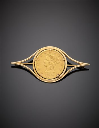 Spilla in oro giallo, con dieci dollari degli Stati Uniti del 1888, g. 26,50...
