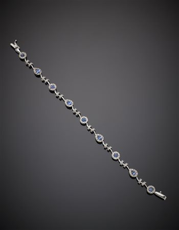 Bracciale in oro bianco con diamanti e zaffiri rotondi e a goccia g. 10,90...