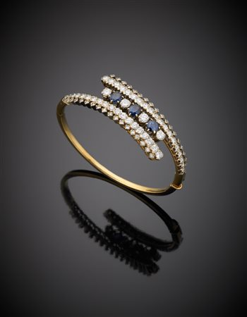 Bracciale rigido in oro bianco e giallo, diamanti rotondi per complessivi ct....