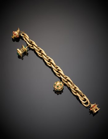 Bracciale in oro giallo a rolò ovale lucida e rigata con quattro charms g....