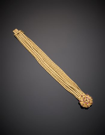 Bracciale in oro giallo a undici fili piatti segmentati, in oro lucido e...