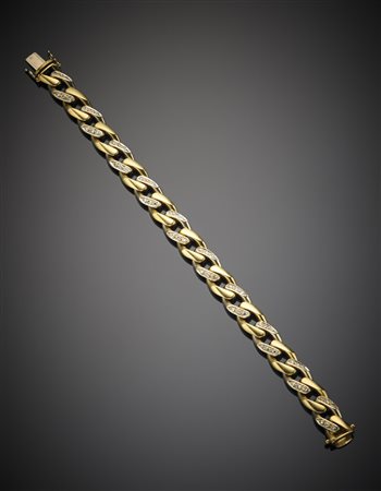 Bracciale a maglia groumette allungata in oro giallo e bianco con incastonati...