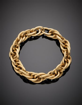 Bracciale rolò a maglie ovali intrecciate e rigate, punzonato 23 MI, g....