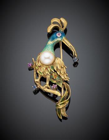 Spilla a guisa di uccello del paradiso con rubini e zaffiri rotondi, smalto...