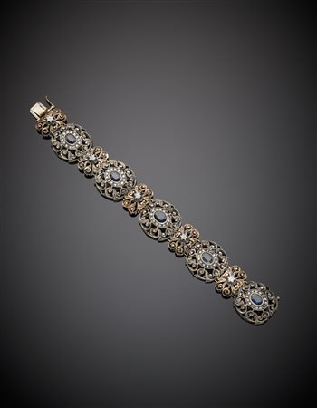 Bracciale modulare a volute floreali in oro a 585/1000 e argento, con zaffiri...