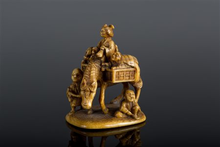 Arte Giapponese Netsuke in avorio raffigurante dei contadini su un carretto....