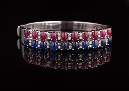Bracciale oro bianco gr 46.60, diamanti cts 0.60, zaffiri e rubini cts. 14...