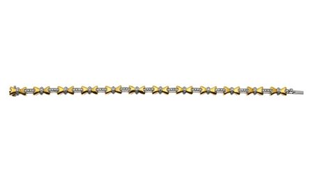 BRACCIALE Peso gr 27,7 Lunghezza cm 18 composto da fiocchi in oro giallo...